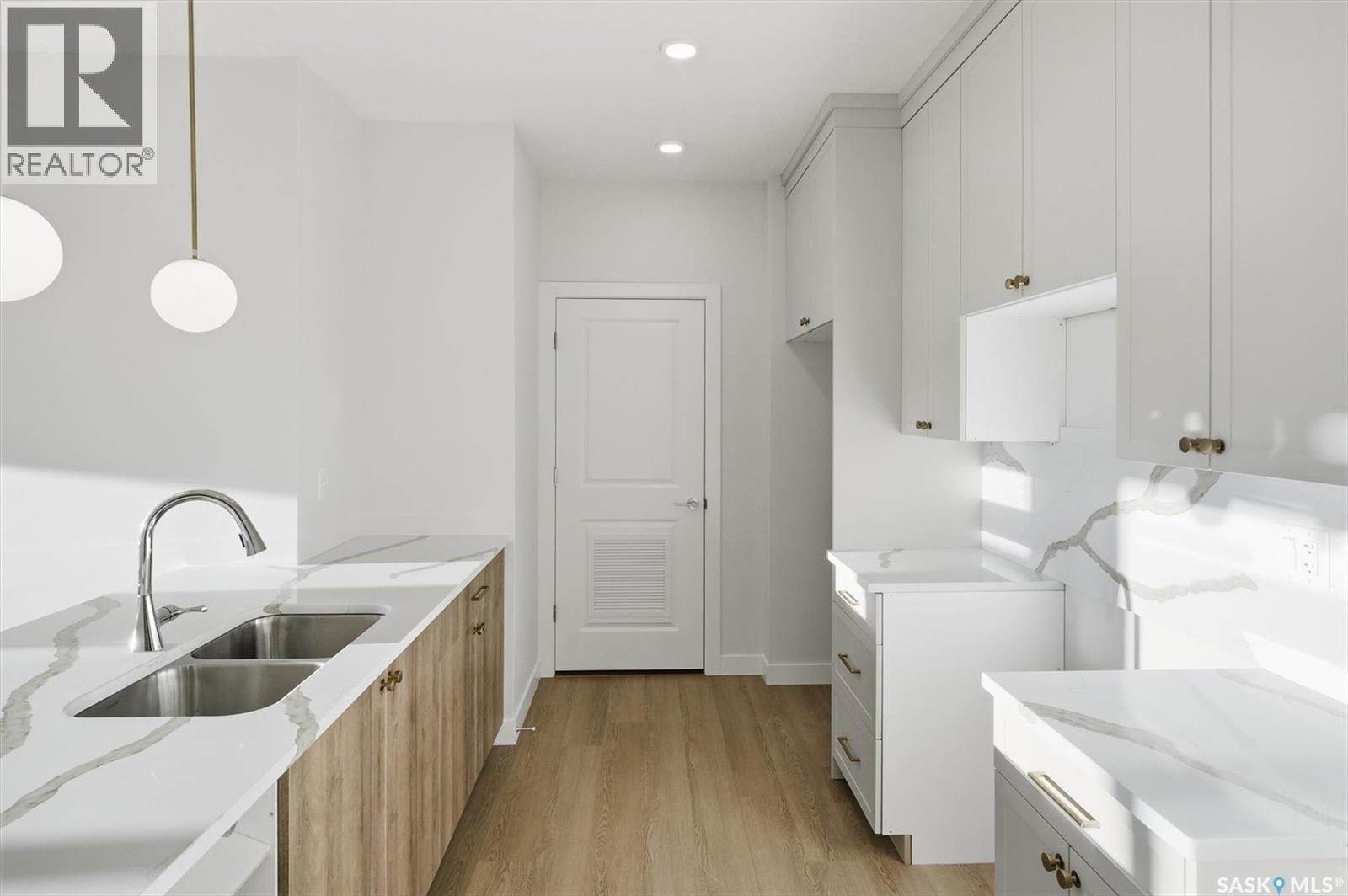 1303 101 Secord Way, Saskatoon, SK - Indoor Photo Showing Laundry Room