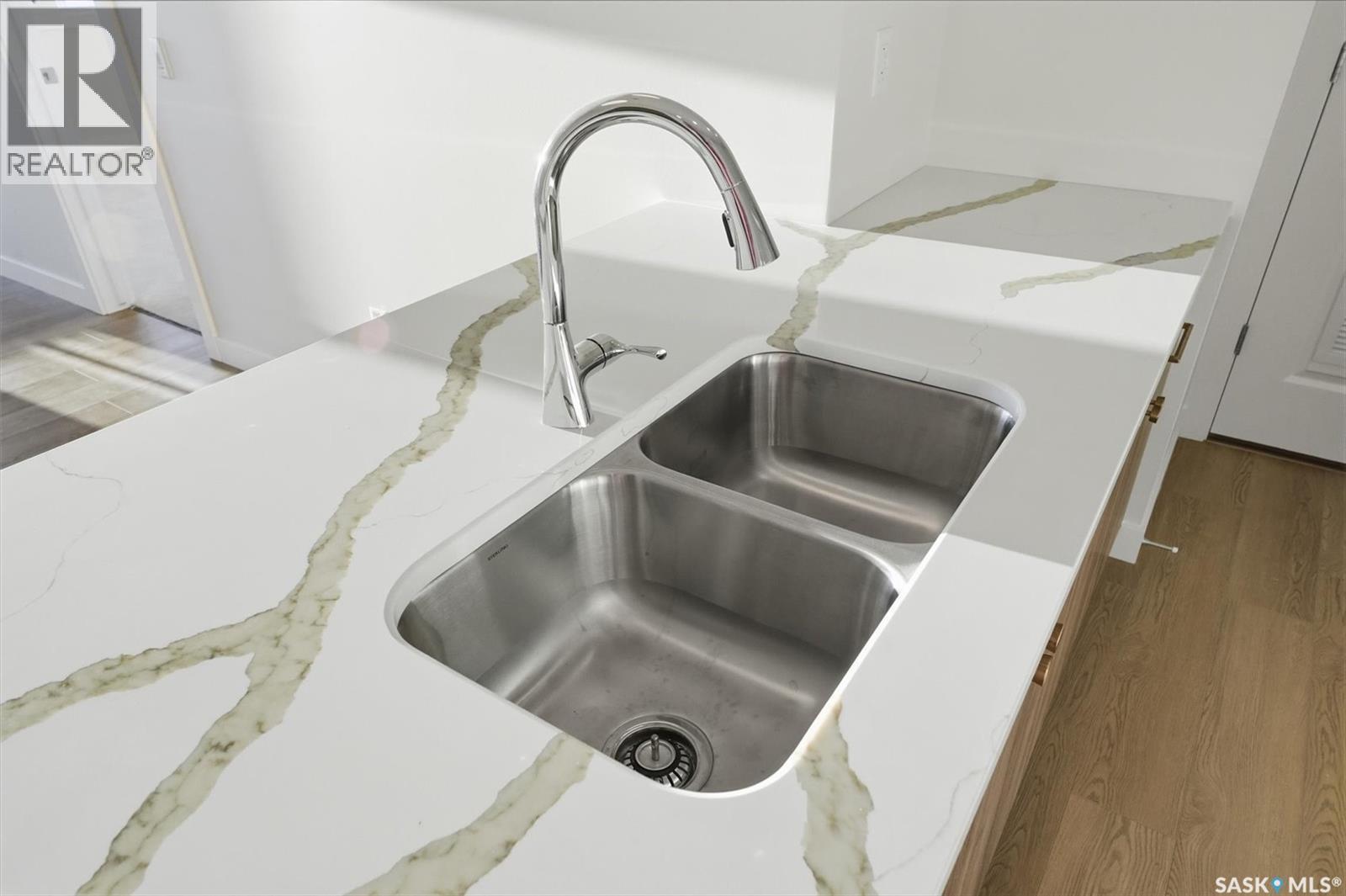 1303 101 Secord Way, Saskatoon, SK - Indoor Photo Showing Kitchen With Double Sink