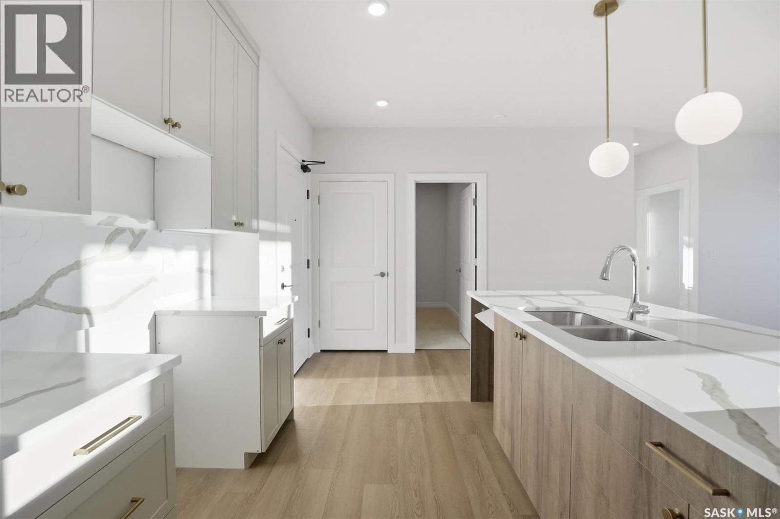 1303 101 Secord Way, Saskatoon, SK - Indoor Photo Showing Kitchen With Double Sink