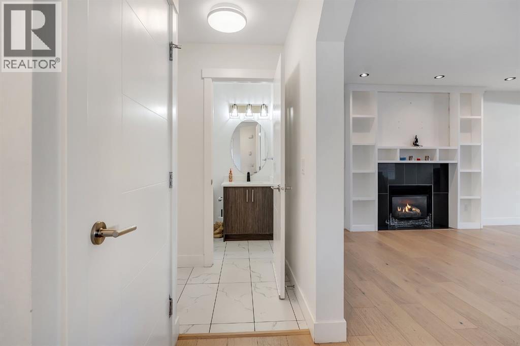 278 Saddlefield Place Ne, Calgary, AB - Indoor Photo Showing Other Room With Fireplace