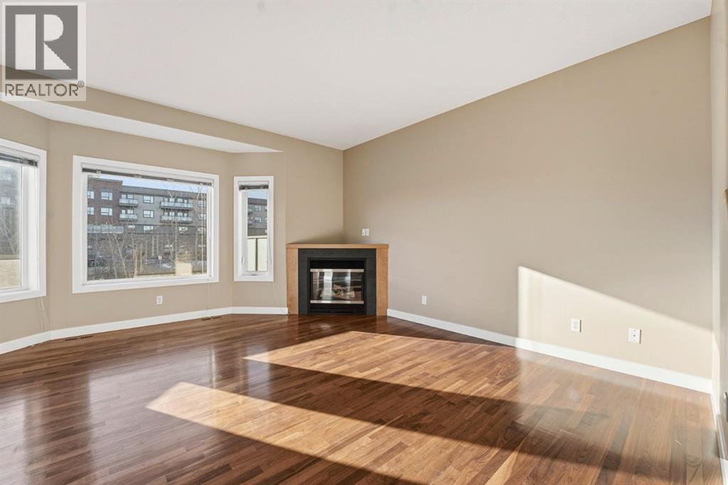 33 Prominence Park Sw, Calgary, AB - Indoor Photo Showing Living Room With Fireplace