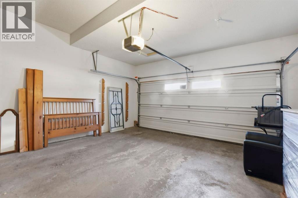 33 Prominence Park Sw, Calgary, AB - Indoor Photo Showing Garage