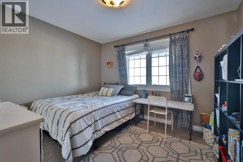 233073 Twp Rd 45, Spring Coulee, AB - Indoor Photo Showing Bedroom