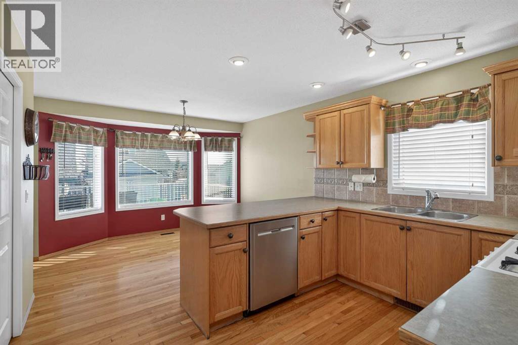25 Westfall Drive, Okotoks, AB - Indoor Photo Showing Kitchen With Double Sink