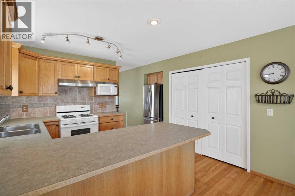 25 Westfall Drive, Okotoks, AB - Indoor Photo Showing Kitchen With Double Sink