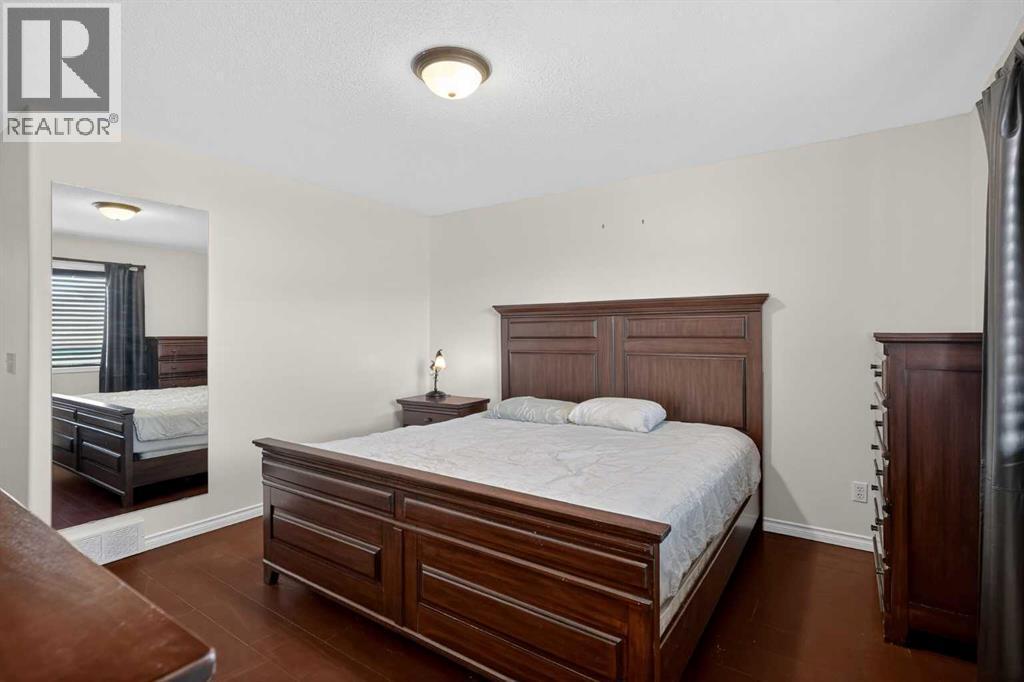 25 Westfall Drive, Okotoks, AB - Indoor Photo Showing Bedroom