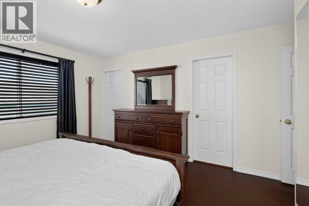 25 Westfall Drive, Okotoks, AB - Indoor Photo Showing Bedroom