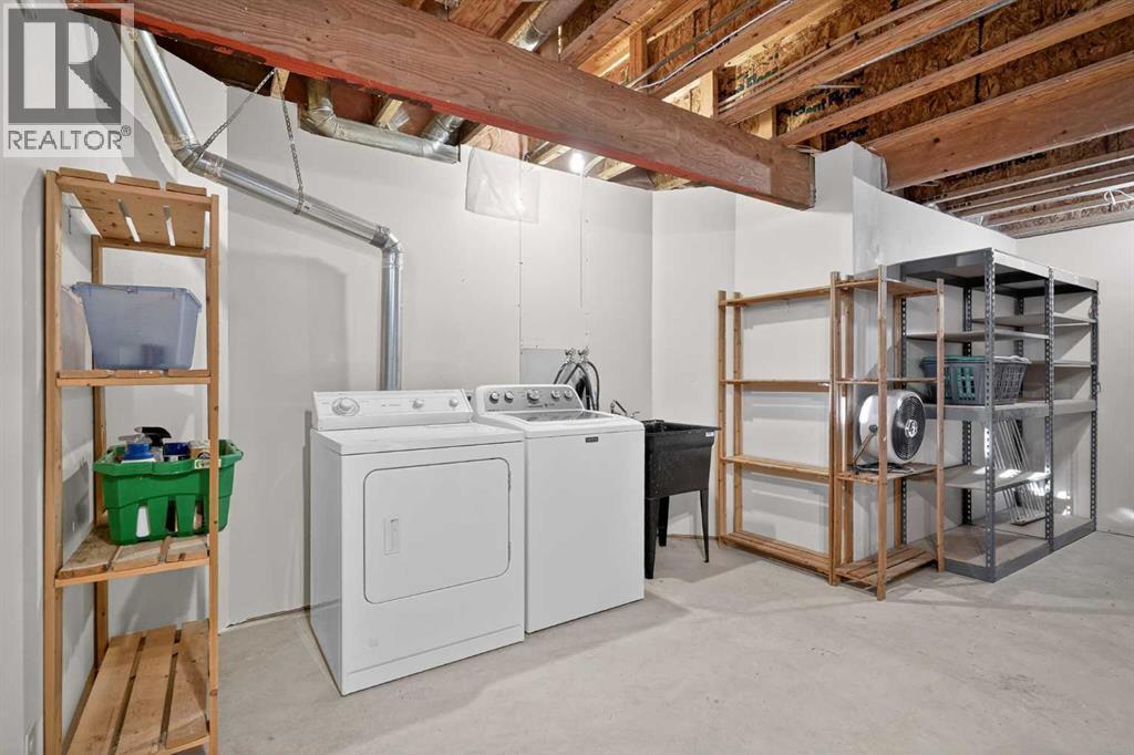 25 Westfall Drive, Okotoks, AB - Indoor Photo Showing Laundry Room