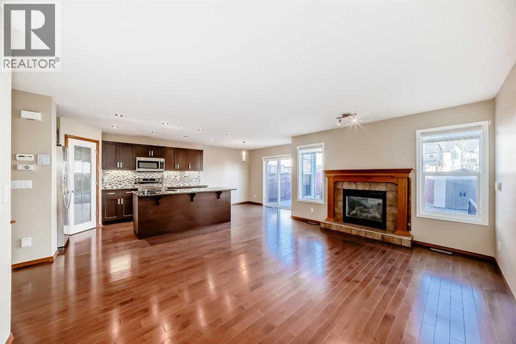 38 Springborough Way Sw, Calgary, AB - Indoor Photo Showing Other Room With Fireplace