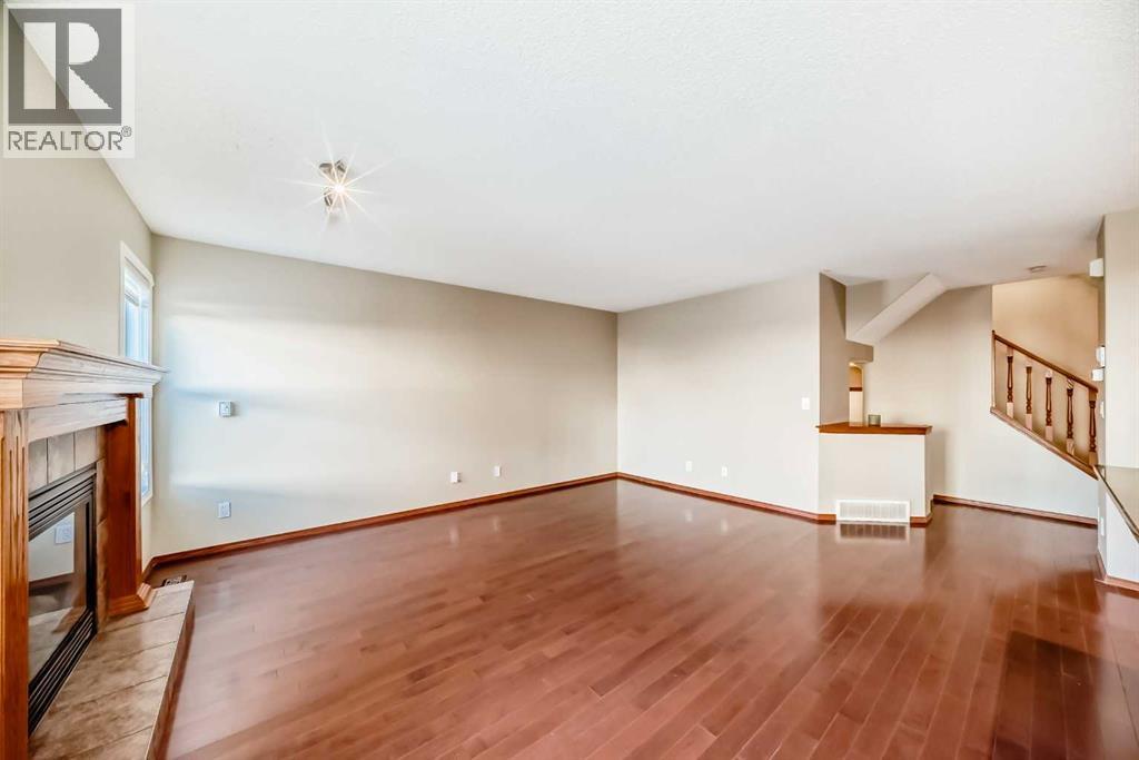 38 Springborough Way Sw, Calgary, AB - Indoor Photo Showing Other Room With Fireplace