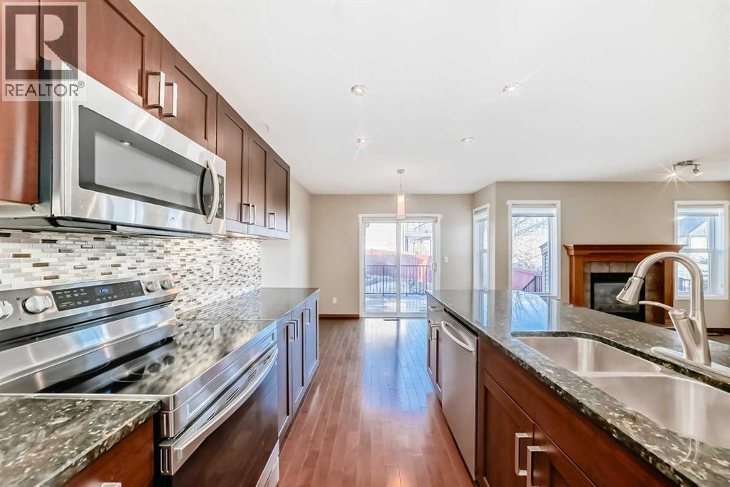 38 Springborough Way Sw, Calgary, AB - Indoor Photo Showing Kitchen With Double Sink With Upgraded Kitchen