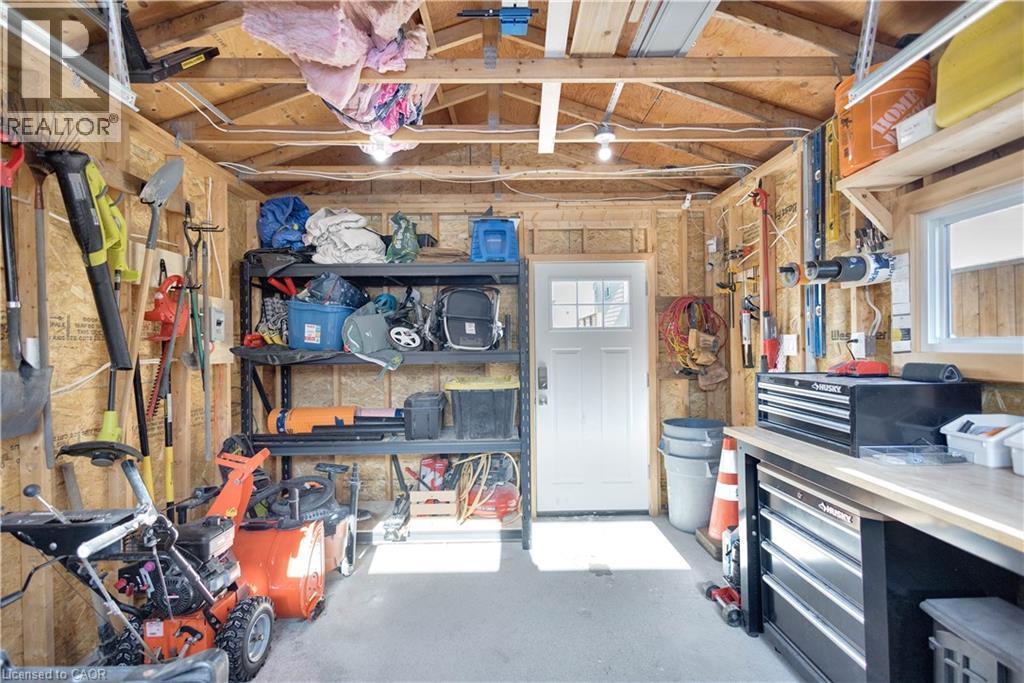 Garage featuring a workshop area - 37 Chatham Street, Hamilton, ON - Indoor Photo Showing Basement