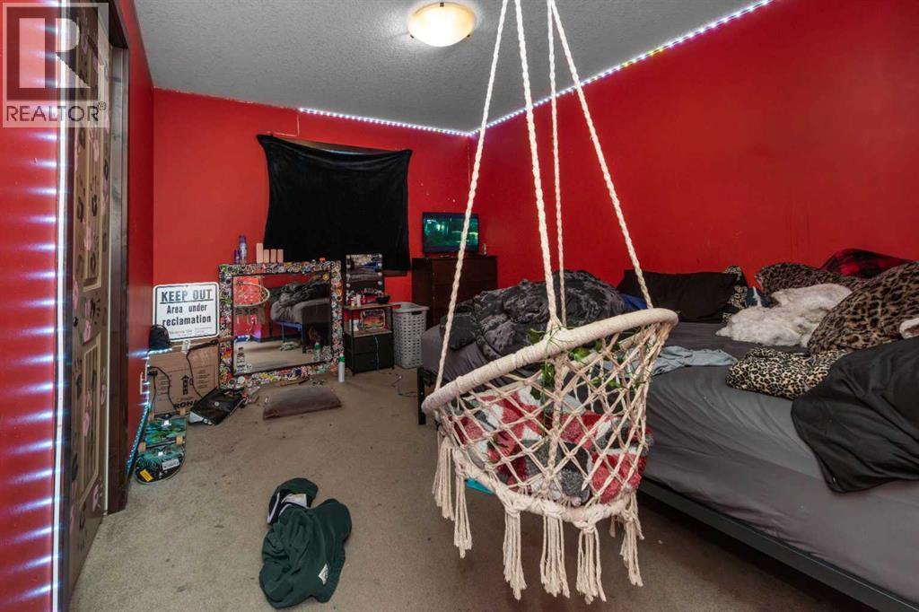 100 Willow Ridge Link, Diamond Valley, AB - Indoor Photo Showing Other Room