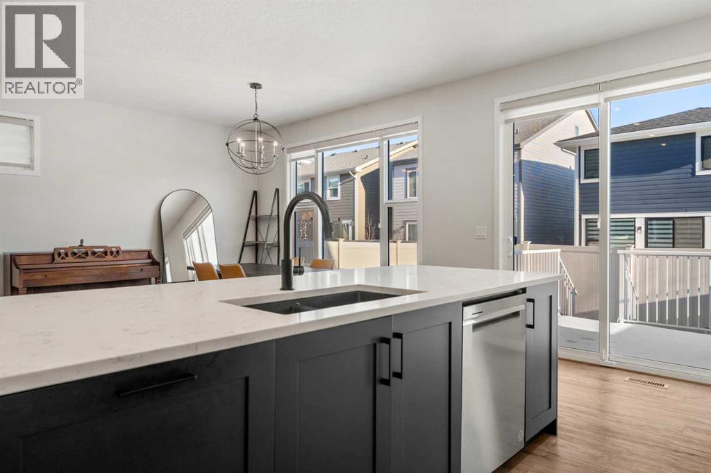40 West Grove Link Sw, Calgary, AB - Indoor Photo Showing Kitchen With Double Sink