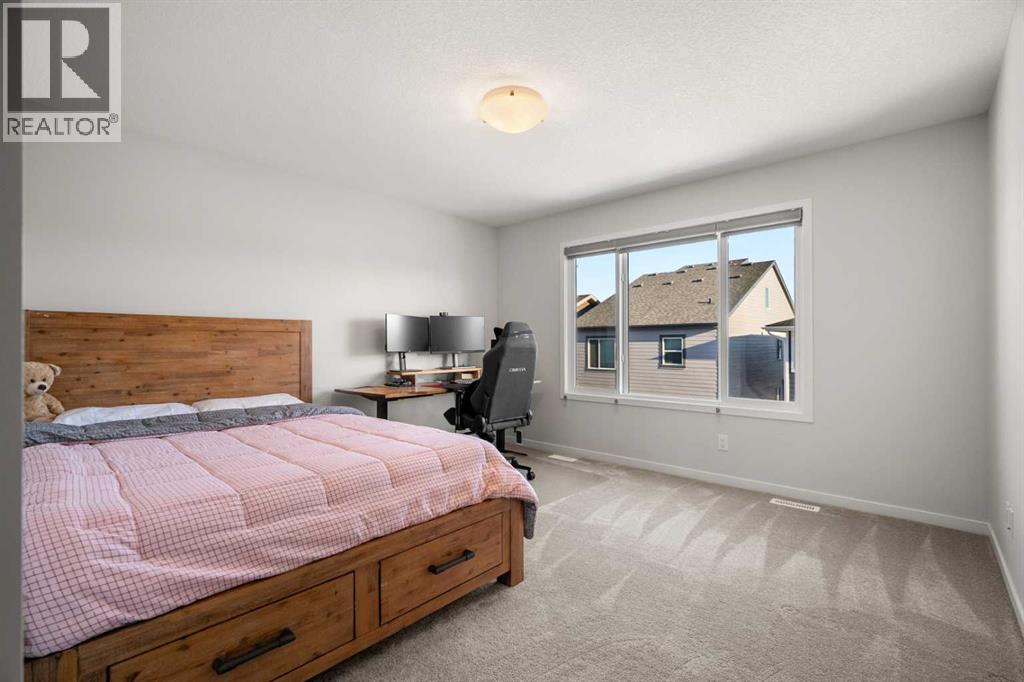 40 West Grove Link Sw, Calgary, AB - Indoor Photo Showing Bedroom