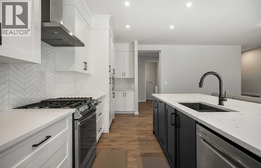 40 West Grove Link Sw, Calgary, AB - Indoor Photo Showing Kitchen With Upgraded Kitchen