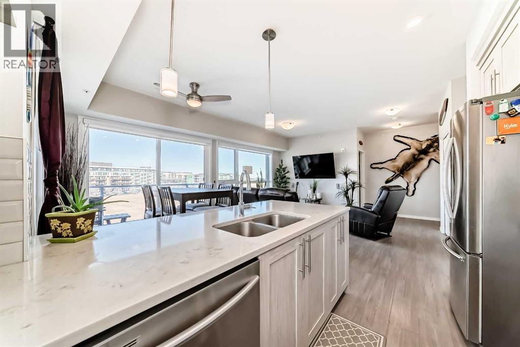 409, 4150 Seton Drive Se, Calgary, AB - Indoor Photo Showing Kitchen With Double Sink With Upgraded Kitchen