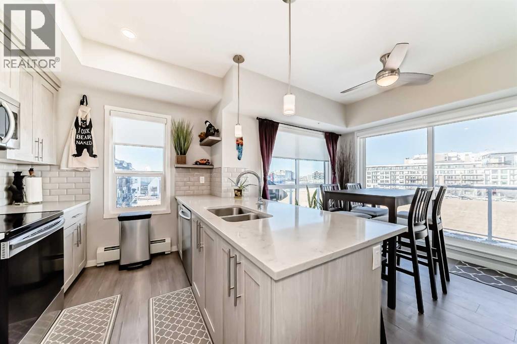 409, 4150 Seton Drive Se, Calgary, AB - Indoor Photo Showing Kitchen With Double Sink With Upgraded Kitchen