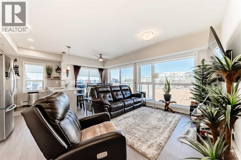 409, 4150 Seton Drive Se, Calgary, AB - Indoor Photo Showing Living Room