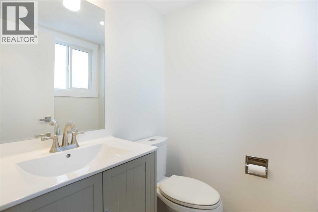 1/2 bath - main floor - 14668 Deer Run Drive Se, Calgary, AB - Indoor Photo Showing Bathroom