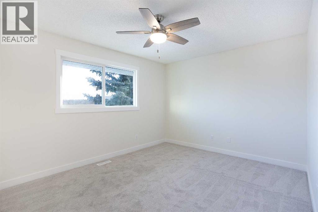 Primary bedroom - upstairs - 14668 Deer Run Drive Se, Calgary, AB - Indoor Photo Showing Other Room
