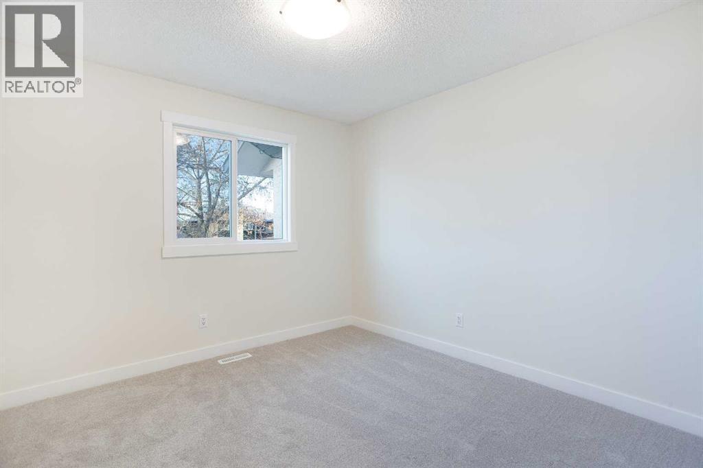 Bedroom #3 - upstairs - 14668 Deer Run Drive Se, Calgary, AB - Indoor Photo Showing Other Room