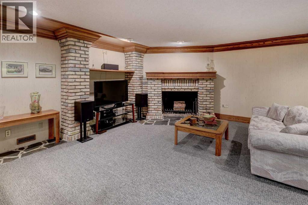 76 Edgeland Road Nw, Calgary, AB - Indoor Photo Showing Living Room With Fireplace