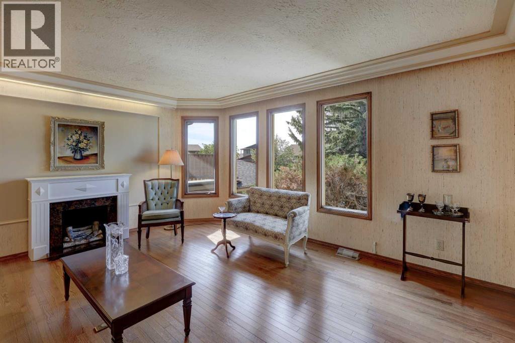 76 Edgeland Road Nw, Calgary, AB - Indoor Photo Showing Living Room With Fireplace