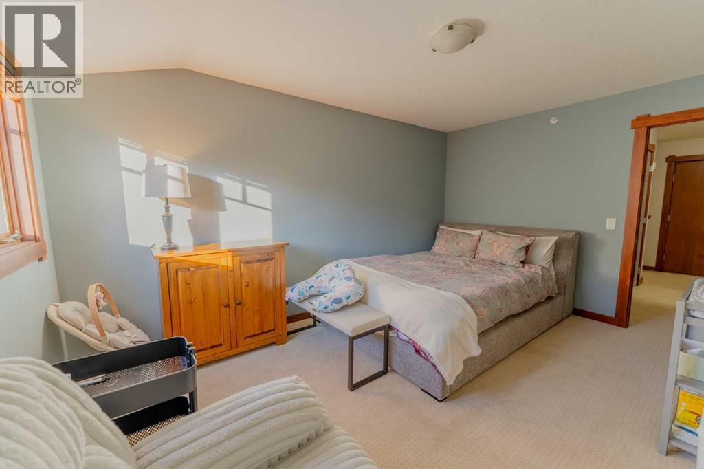 313, 170 Crossbow Place, Canmore, AB - Indoor Photo Showing Bedroom