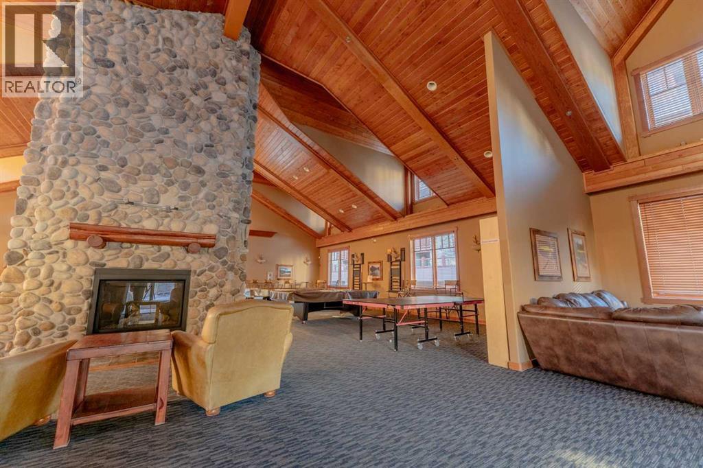 313, 170 Crossbow Place, Canmore, AB - Indoor With Fireplace