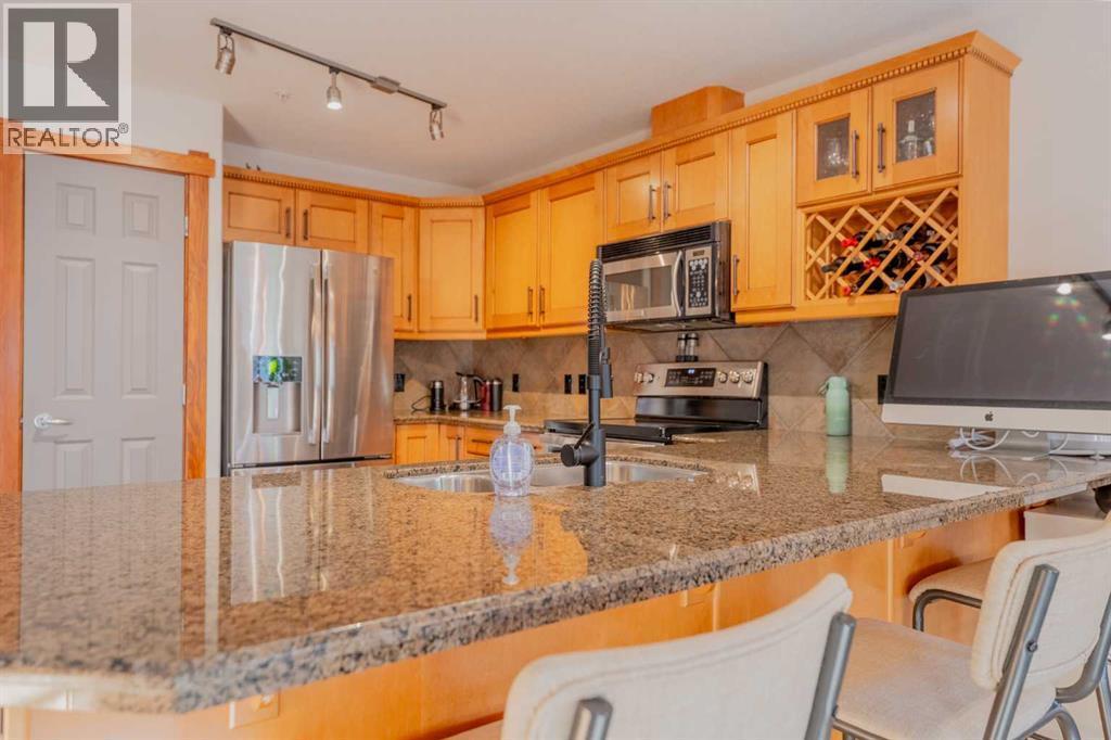 313, 170 Crossbow Place, Canmore, AB - Indoor Photo Showing Kitchen