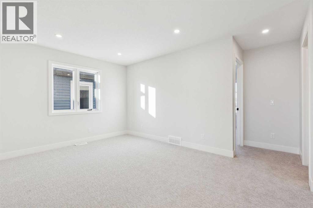 120 Quartz Crescent, Cochrane, AB - Indoor Photo Showing Other Room