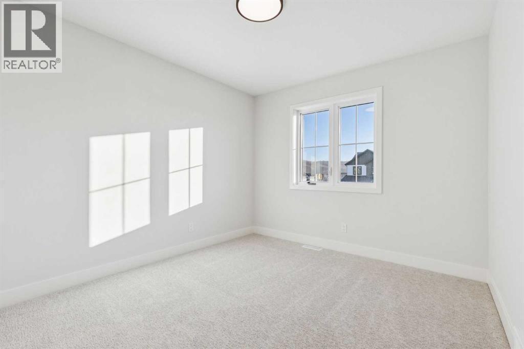 120 Quartz Crescent, Cochrane, AB - Indoor Photo Showing Other Room