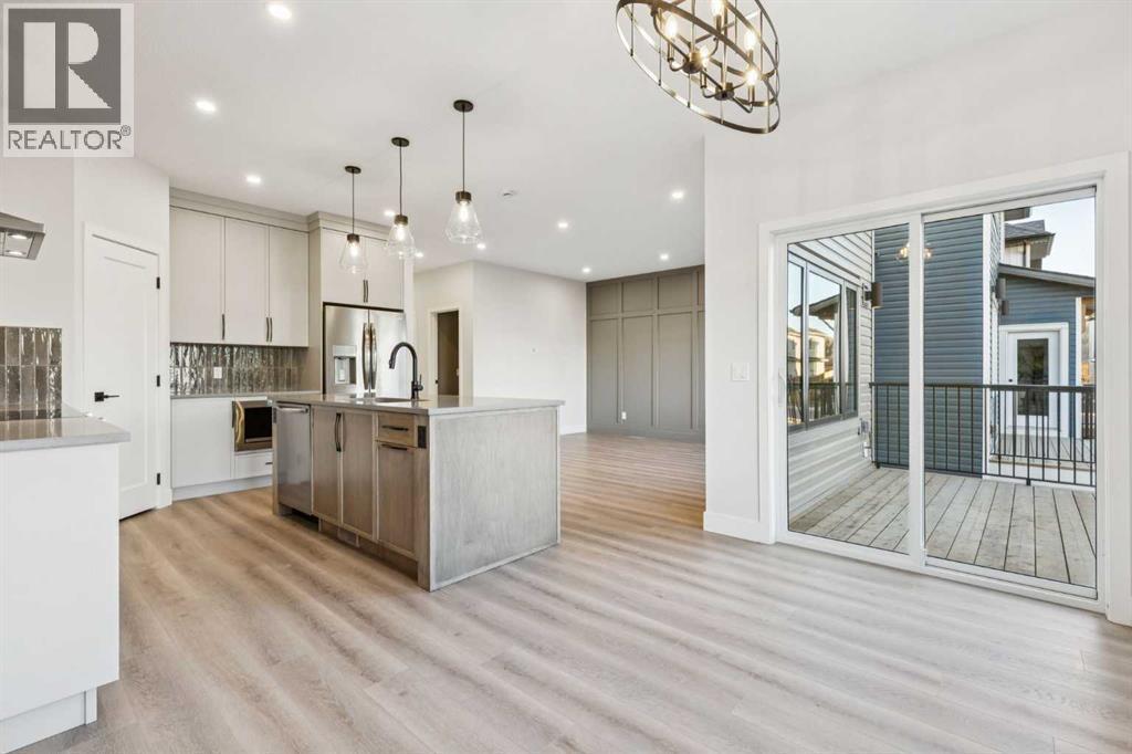 120 Quartz Crescent, Cochrane, AB - Indoor Photo Showing Kitchen With Upgraded Kitchen