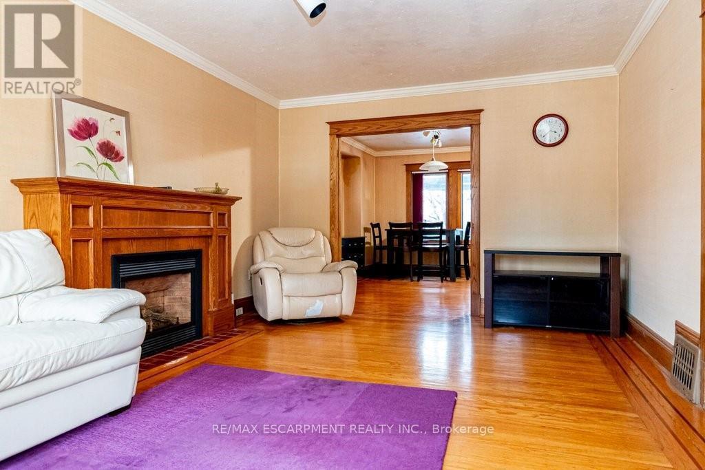 88 Cline Avenue N, Hamilton, ON - Indoor Photo Showing Living Room With Fireplace