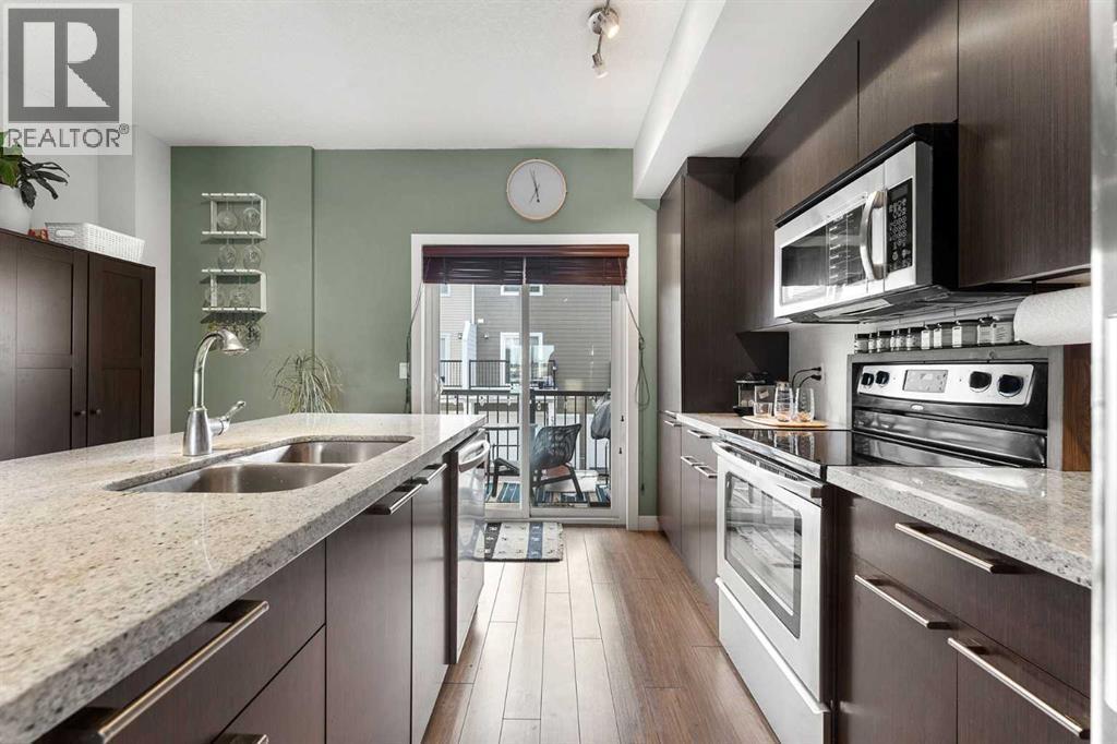 39 Silverado Way Sw, Calgary, AB - Indoor Photo Showing Kitchen With Double Sink With Upgraded Kitchen