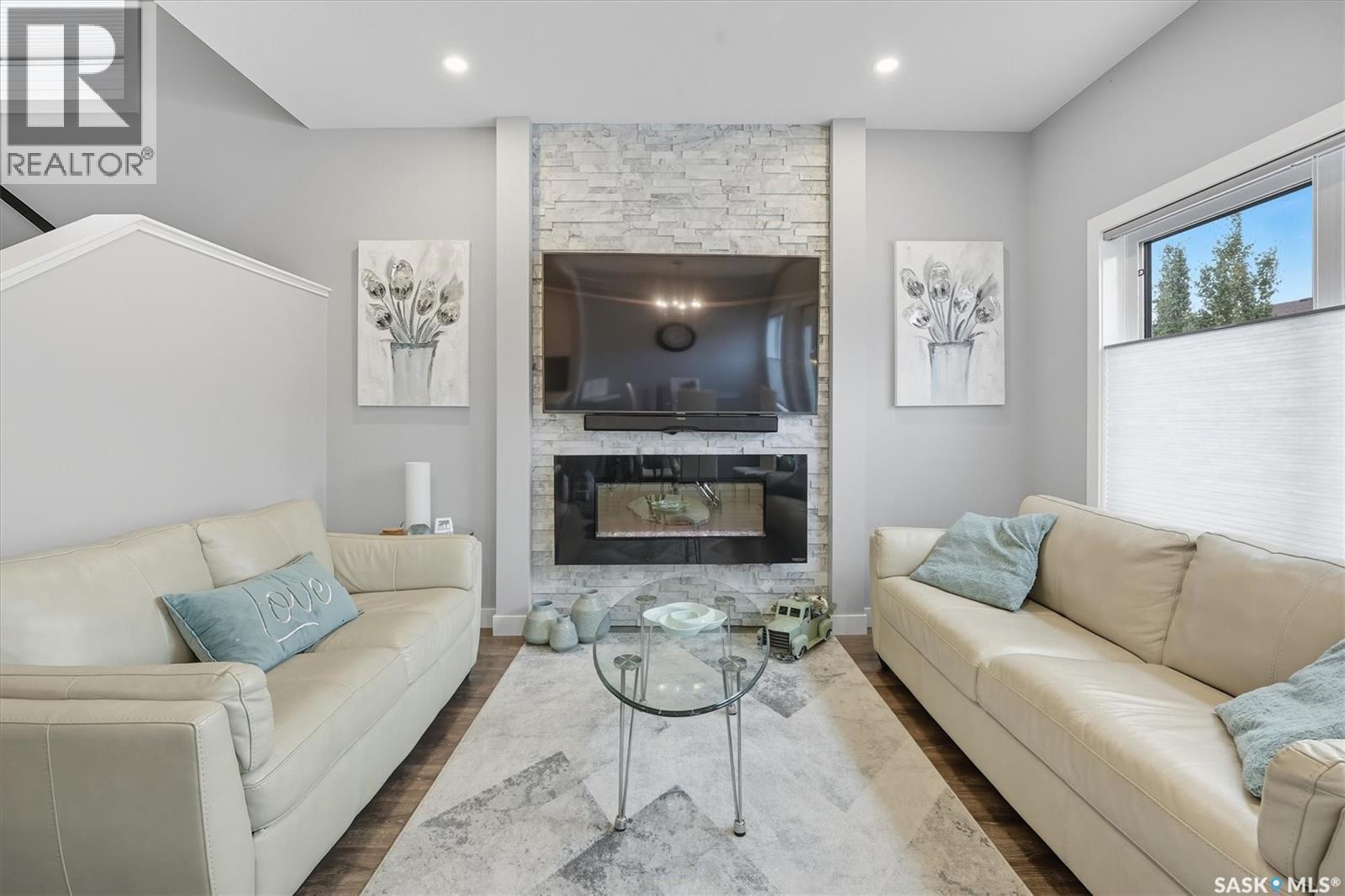 242 Brighton Gate, Saskatoon, SK - Indoor Photo Showing Living Room With Fireplace