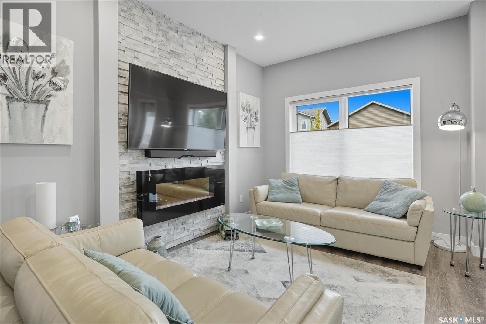 242 Brighton Gate, Saskatoon, SK - Indoor Photo Showing Living Room With Fireplace