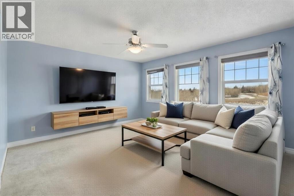 V-Staged - 72 Rockyspring Circle Nw, Calgary, AB - Indoor Photo Showing Living Room