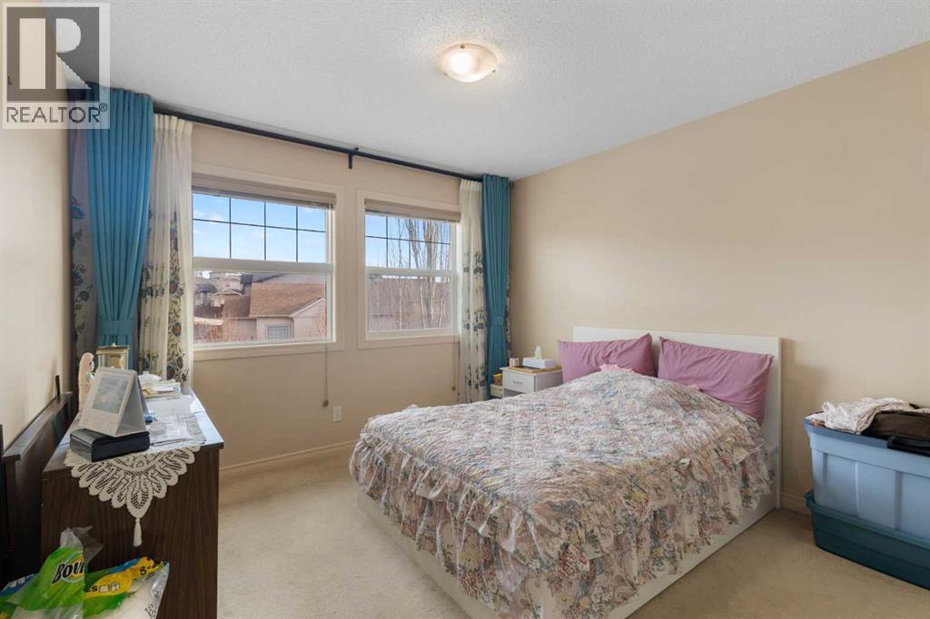 72 Rockyspring Circle Nw, Calgary, AB - Indoor Photo Showing Bedroom