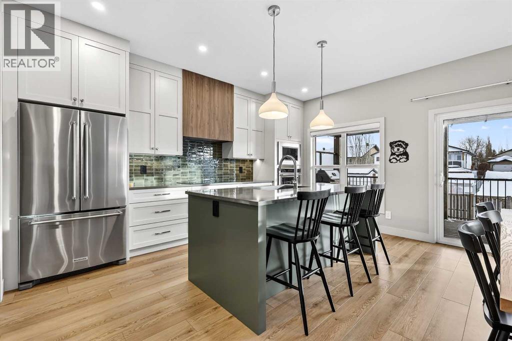 Water Supplied Fridge and Icemaker - 24 Napoleon Meadows Way, Innisfail, AB - Indoor Photo Showing Kitchen With Upgraded Kitchen
