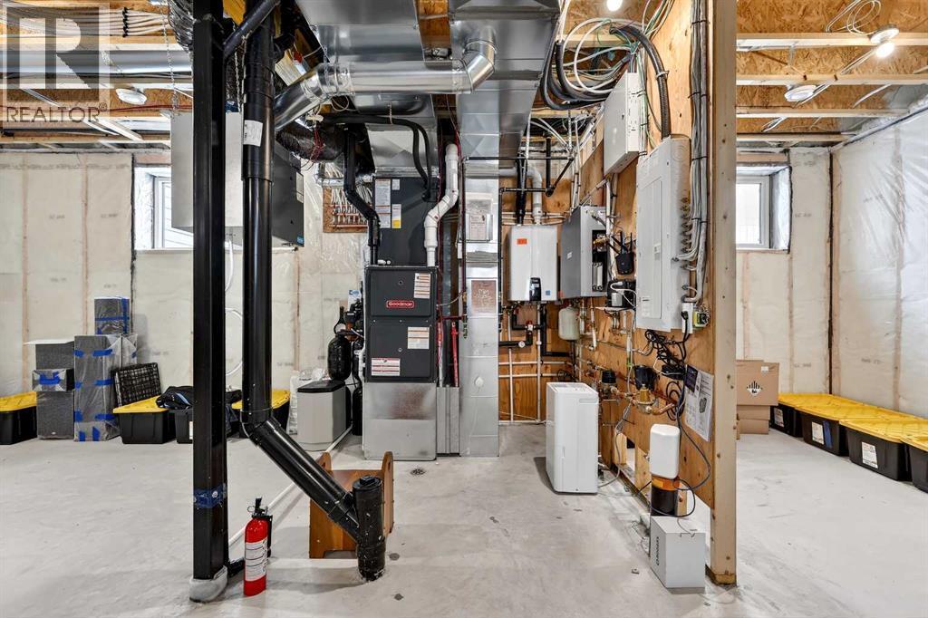 Navien Tankless Hot Water Heater, 125A Service, HRV, Chlorine Filtration, Water Softener, Reverse Osmosis, and Re Mineralization System - 24 Napoleon Meadows Way, Innisfail, AB - Indoor Photo Showing Basement