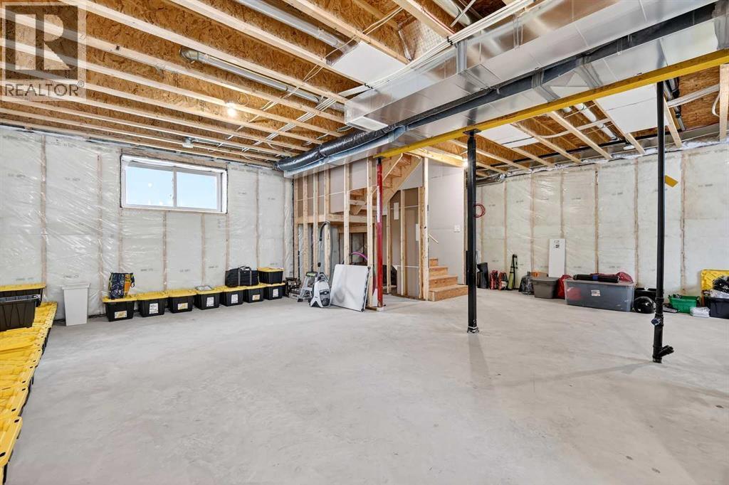 9' Basement Ceilings / In Floor Heat with 2 Zones and 2 Thermostats - 24 Napoleon Meadows Way, Innisfail, AB - Indoor Photo Showing Basement