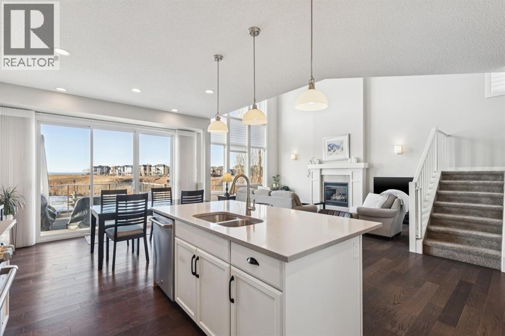 101 Cranarch Common Se, Calgary, AB - Indoor Photo Showing Kitchen With Fireplace With Double Sink
