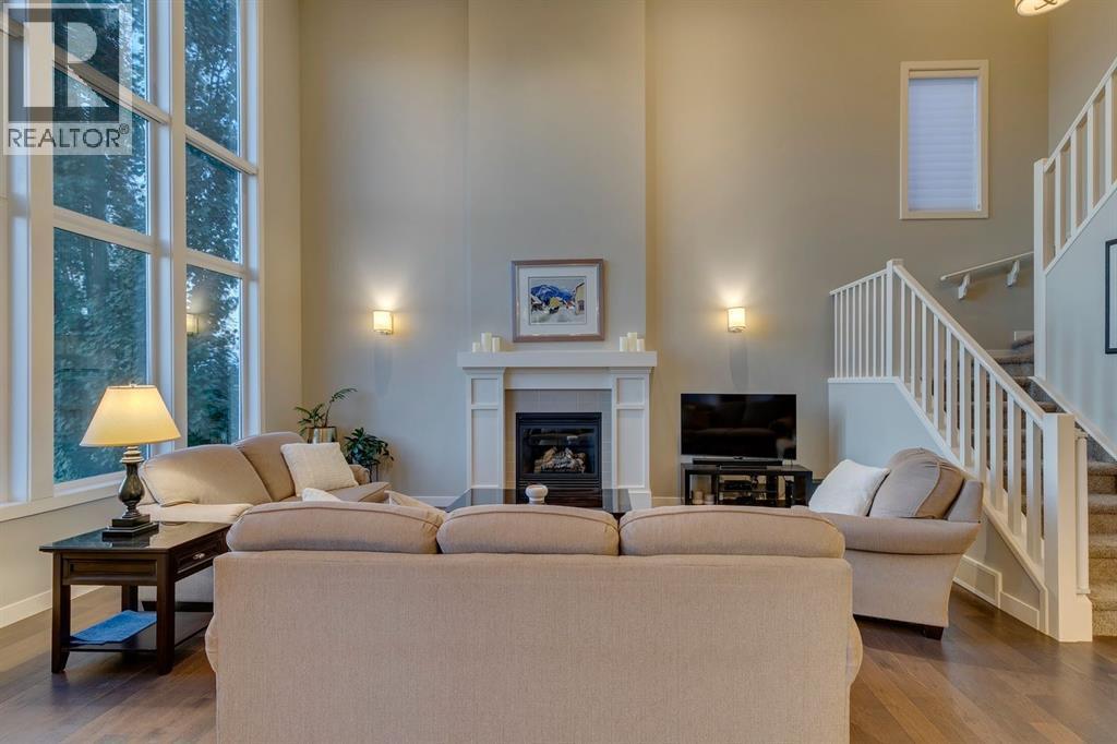 101 Cranarch Common Se, Calgary, AB - Indoor Photo Showing Living Room With Fireplace