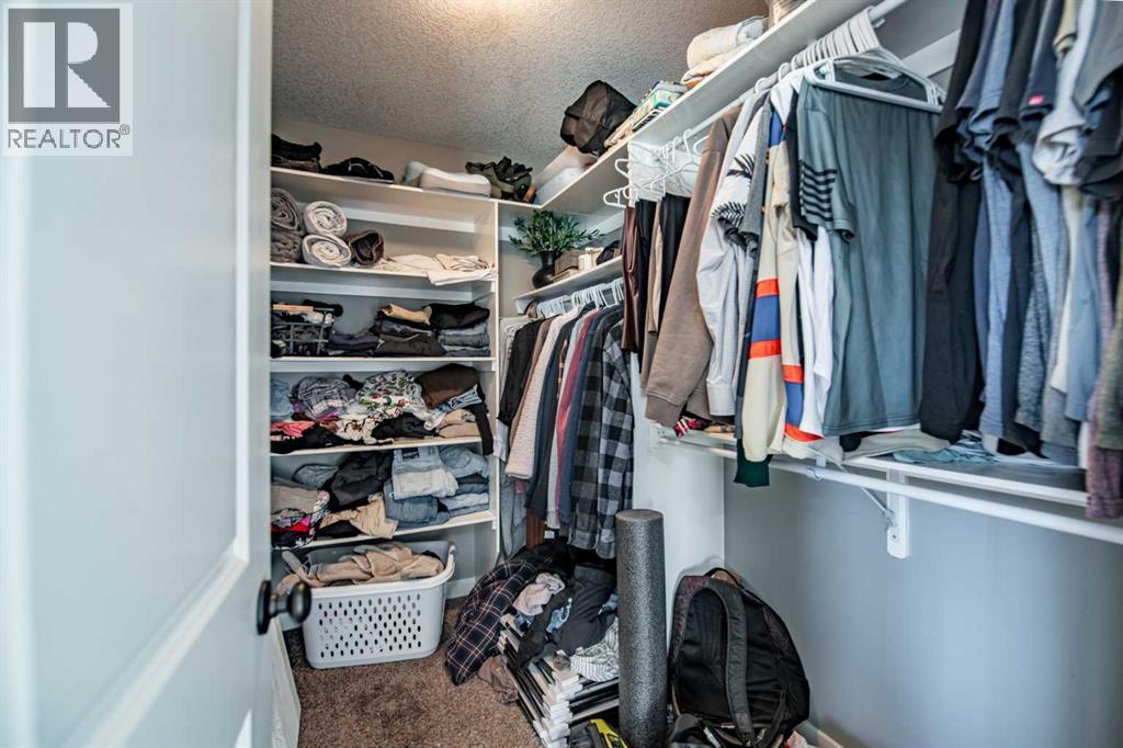 Walk In Closet - 53 Portway Close, Blackfalds, AB - Indoor With Storage
