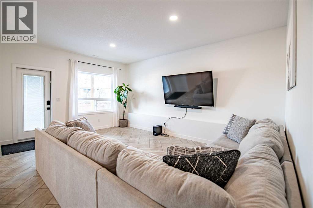 Basement Living Room - 53 Portway Close, Blackfalds, AB - Indoor Photo Showing Living Room