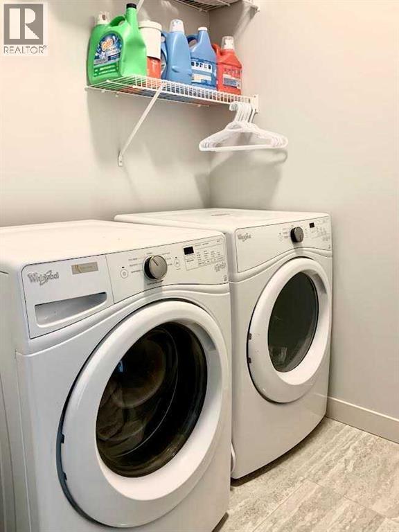 743 Shawnee Drive Sw, Calgary, AB - Indoor Photo Showing Laundry Room