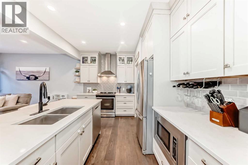 743 Shawnee Drive Sw, Calgary, AB - Indoor Photo Showing Kitchen With Double Sink With Upgraded Kitchen