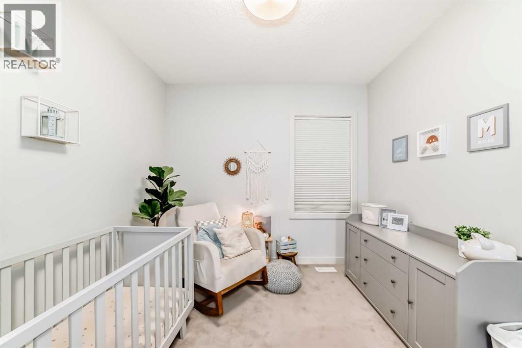 743 Shawnee Drive Sw, Calgary, AB - Indoor Photo Showing Bedroom